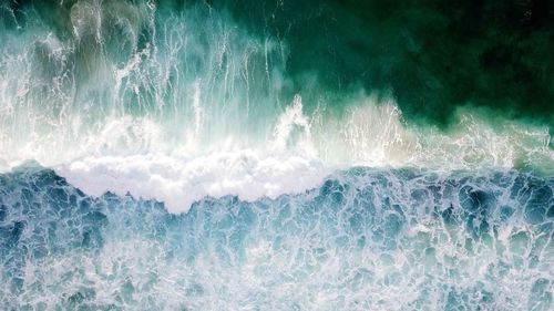 Full frame shot of waves splashing in sea