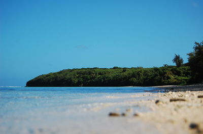 Scenic view of sea against clear blue sky