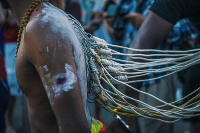 Close-up of man fishing net at market