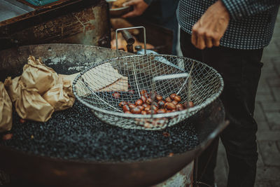 Midsection of man preparing food