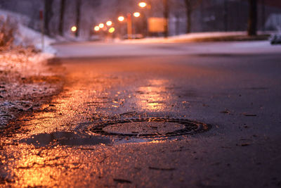 Surface level of wet road at night