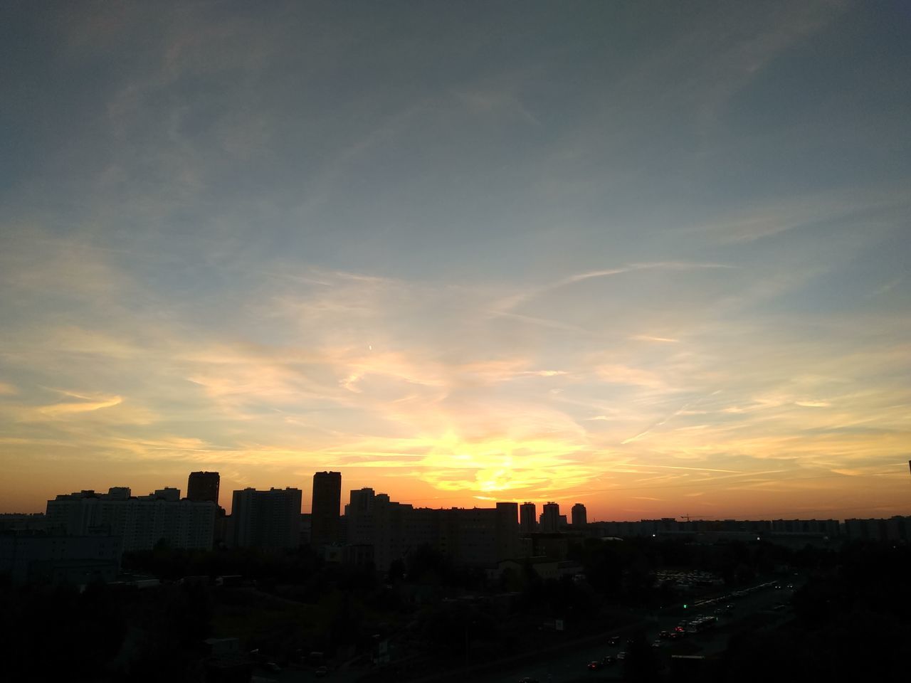 SILHOUETTE BUILDINGS AGAINST SKY AT SUNSET