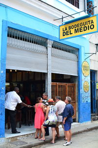 People walking in front of building