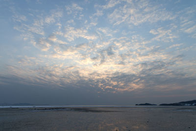 Scenic view of sea against sky at sunset