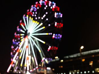 Low angle view of firework display at night