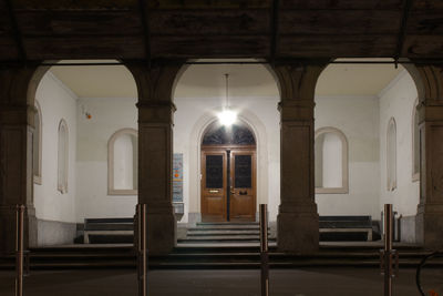 Illuminated entrance of historic building