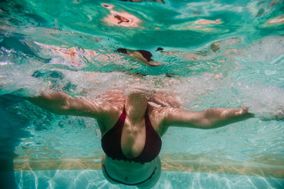 Woman swimming in sea