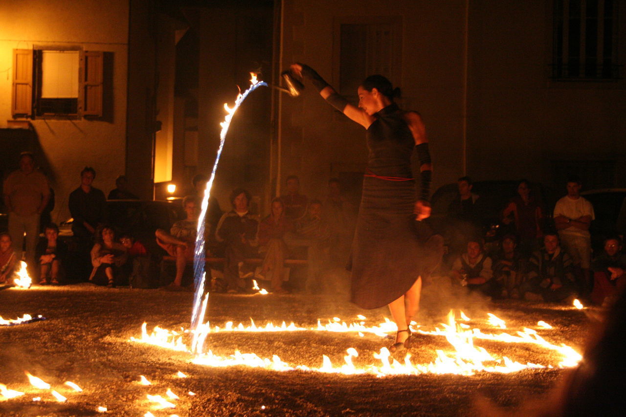 GROUP OF PEOPLE AT NIGHT DURING FESTIVAL