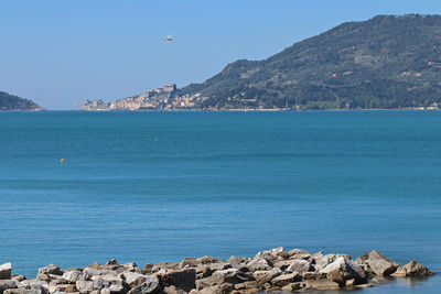 Scenic view of sea against blue sky