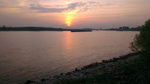 Scenic view of sea at sunset