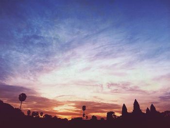 Silhouette of built structure at sunset