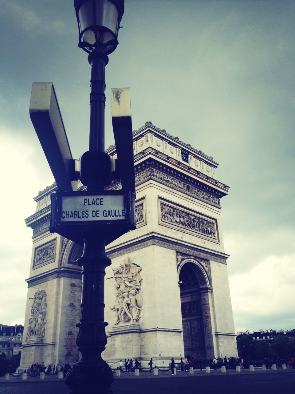 architecture, built structure, low angle view, building exterior, famous place, travel destinations, sky, architectural column, tourism, travel, history, international landmark, column, capital cities, cloud - sky, human representation, statue, sculpture, monument, tower