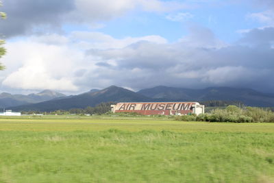 Scenic view of mountains against cloudy sky