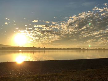 Scenic view of sunset over lake