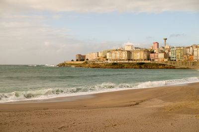 Scenic view of beach against sky