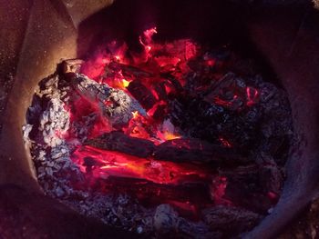 High angle view of fire on wood