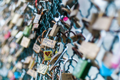 Close-up of padlocks on railing