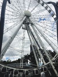 Low angle view of ferris wheel against sky