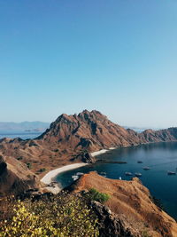 Scenic view of mountains against clear blue sky