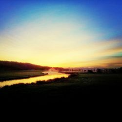 Scenic view of landscape at sunset