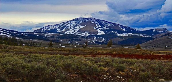 Scenic view of snowcapped mountains against sky