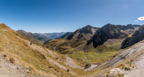 Scenic view of mountains against clear blue sky