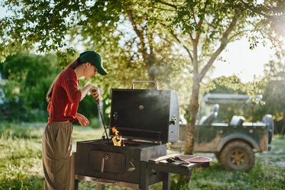 Rear view of man working at park