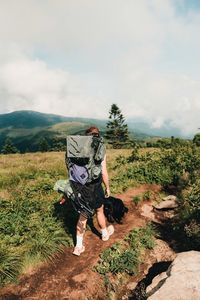 Full length of senior woman against mountain