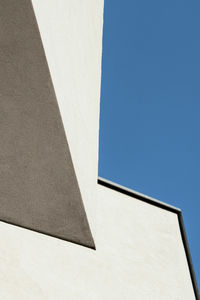 Low angle view of building against clear blue sky