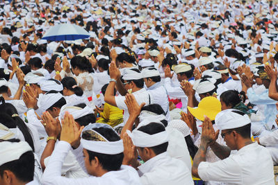 Full frame shot of crowd praying in city