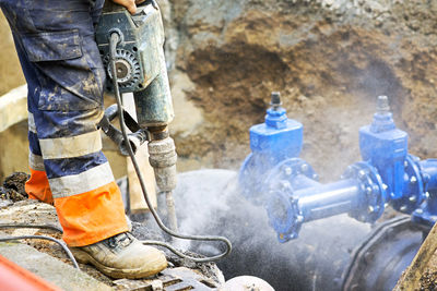 Low section of man working at construction site