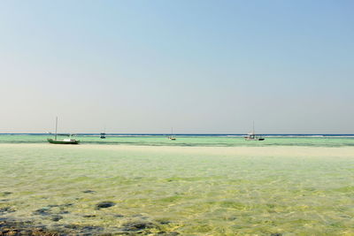 Scenic view of sea against clear sky