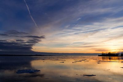 Scenic view of sea against sky at sunset