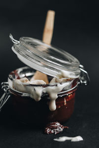 Close-up of ice cream in jar on table