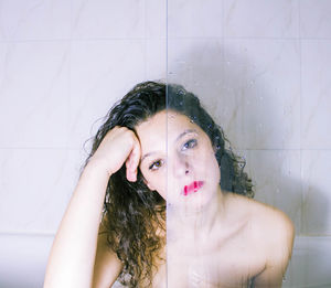 Portrait of young woman in bathroom