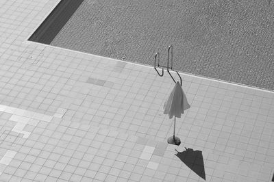 High angle view of sunshade by swimming pool