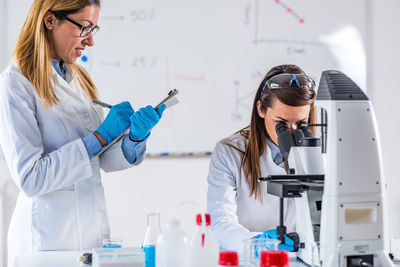 Scientists working in laboratory