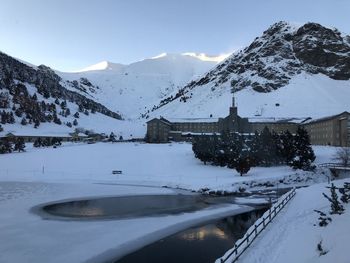 Scenic view of snowcapped mountains against sky during winter