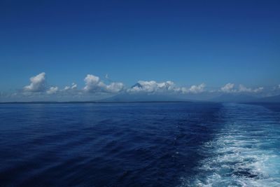 Scenic view of sea against blue sky