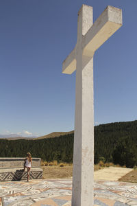 Woman against clear blue sky