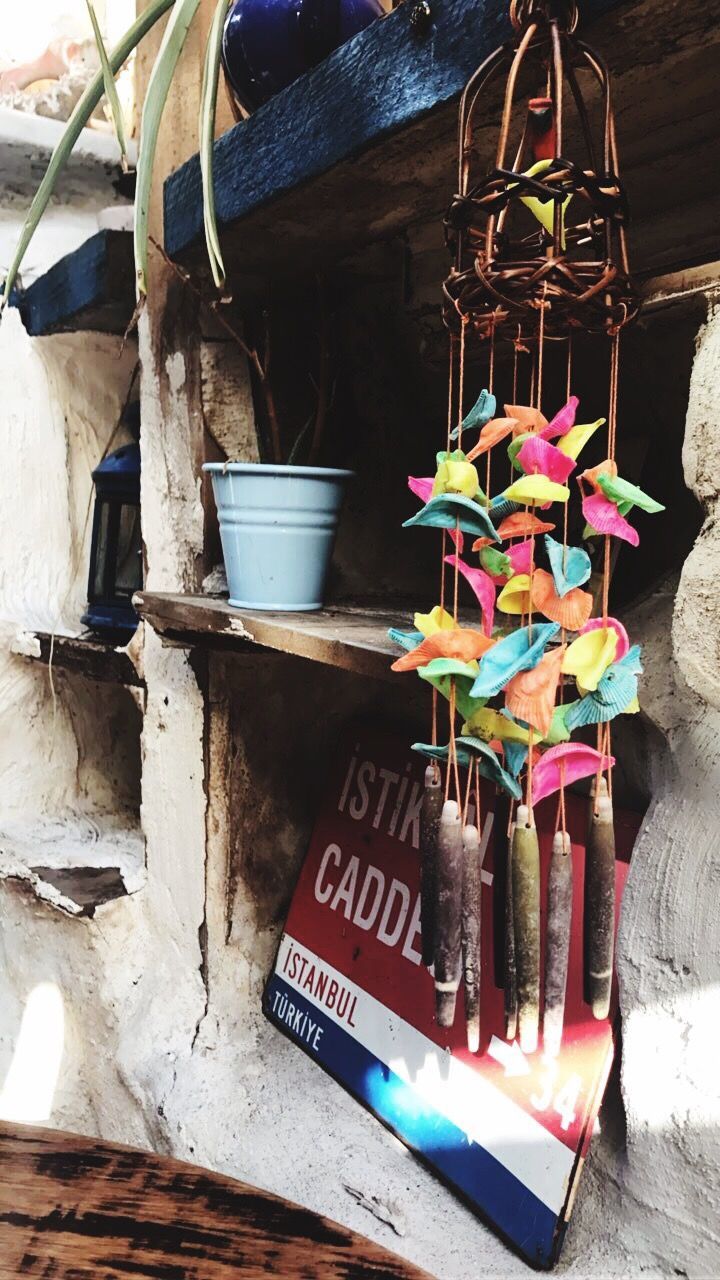 CLOSE-UP OF MULTI COLORED CLOTHES HANGING FOR SALE