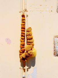 Close-up of cake on metal against wall