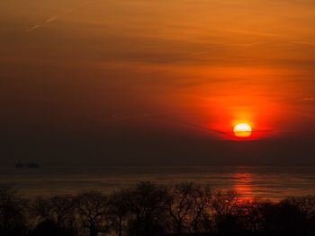 Scenic view of dramatic sky during sunset