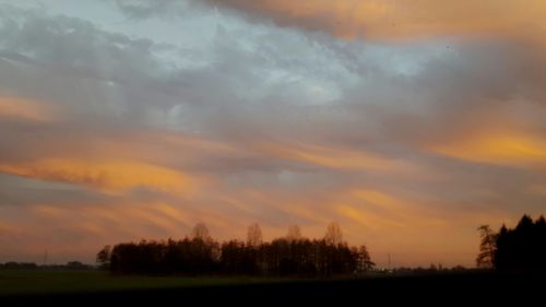 Scenic view of dramatic sky during sunset