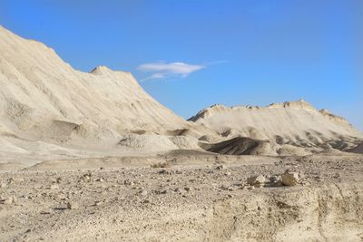 Scenic view of arid landscape against sky