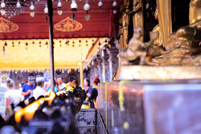 Group of people in temple outside building