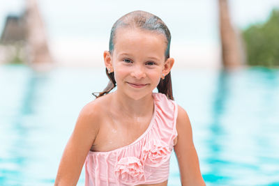 Portrait of young woman in swimming pool