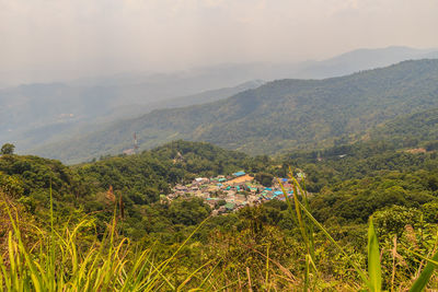 Scenic view of landscape and mountains against sky