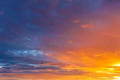 Low angle view of dramatic sky during sunset