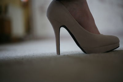 Low section of woman in high heels